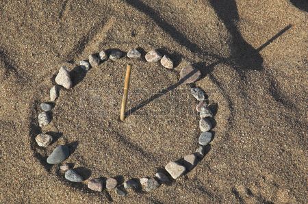 2110232-sundial-on-sea-sand