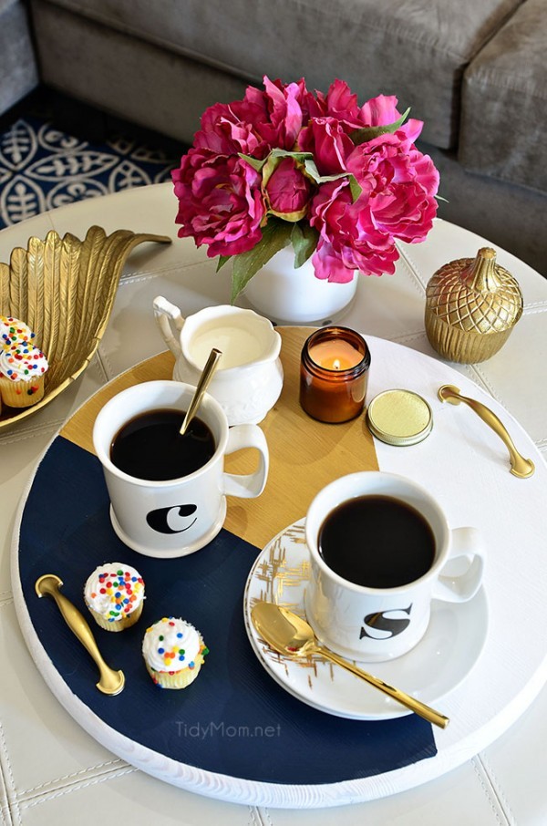 A bold colorful tray is the perfect way to add a pop of color to a space and use it as a serving tray when entertaining. The color blocking gives this tray a modern look while the touch of gold adds a little elegance!  Get the full tutorial to make your own DIY Color Block Tray at TidyMom.net