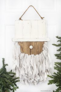 Add this Rustic Santa Door Hanger to your holiday decor -- it's simple to make and such a fun addition to your home or front door!  livelaughrowe.com